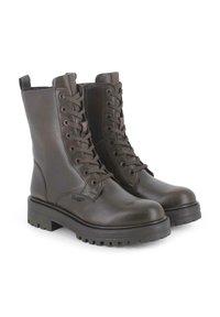 Botas cortas de cuero marrón con acabado liso, cordones delanteros y suela de goma con ranuras antideslizantes. Pequeña lengüeta para tirar en el talón.