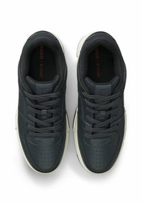 Dark navy leather sneakers with perforated detailing, grey mesh lining, and contrasting white soles. Features traditional lace-up design.