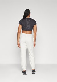 Reebok FRENCH TERRY - Tepláky - chamel