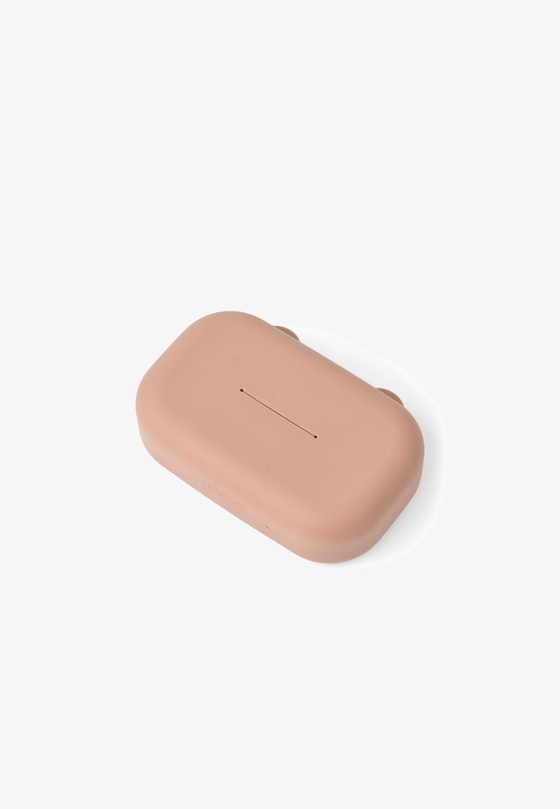 Boîtier rectangulaire beige pour écouteurs sans fil avec des bords arrondis et une fine ligne centrale sur la surface supérieure.