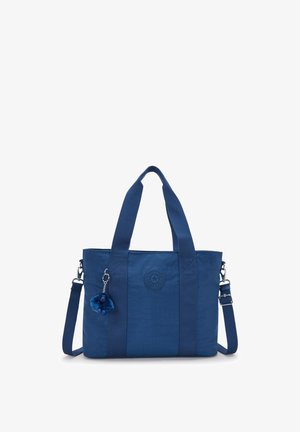 Borsa a spalla blu con due manici, tracolla regolabile, patch del logo circolare e un piccolo portachiavi a forma di scimmietta di peluche attaccato.