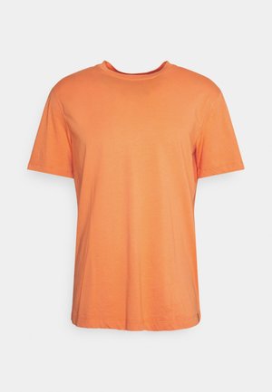 T-shirt orange uni à manches courtes, col rond, coupe décontractée sur fond blanc.