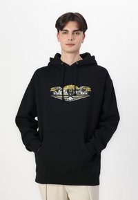 Black pullover hoodie featuring a central graphic with yellow accents, long sleeves, and a front pocket. Made from soft material.