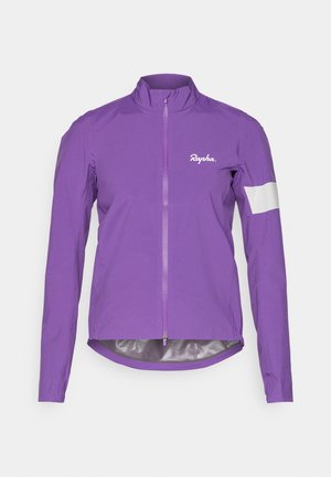 Paarse fietsjacket gemaakt van lichtgewicht materiaal, voorzien van een volledige rits aan de voorkant, hoge kraag en een reflecterende witte accent op de mouw.