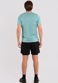 Rukka YLIKIIKA - T-shirt de sport - grün