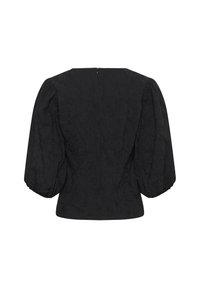 Melna pūkaina piedurkņu blūze ar strukturētu ziedu rakstu, ar taisnu muguru, ar rāvējslēdzēju un savilkta apkakle, nodrošinot pieguļošu siluetu.