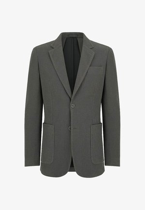 Ciemnozielony blazer wykonany z teksturowanej tkaniny. Posiada klapy, dwie przednie kieszenie, dwa guziki oraz kieszeń na piersi.