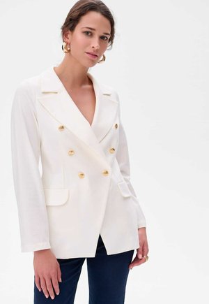 White double-breasted blazer with notched lapels, gold buttons, and two front pockets. Smooth fabric, tailored fit, and long sleeves.