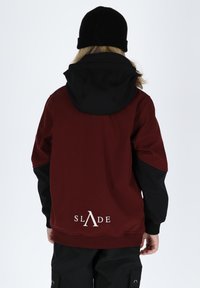 Burgundy hoodie with a black hood, featuring a white logo "SLADE" on the lower back. The sleeves are black with ribbed cuffs.