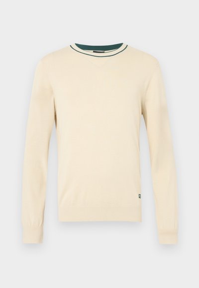 Kreemivärviline pikkade varrukatega kampsun, millel on roheka varrukakääriste ja kraega soonikkoes detailid. Sile tekstuur, tavapärane lõige, väike logo all vasakul.