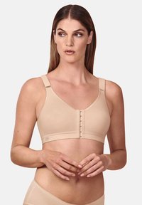 Beige Softcup-BH mit breiten Trägern, Frontverschluss, glatter Textur und nahtlosem Design. Mit leichter Polsterung für zusätzlichen Komfort.