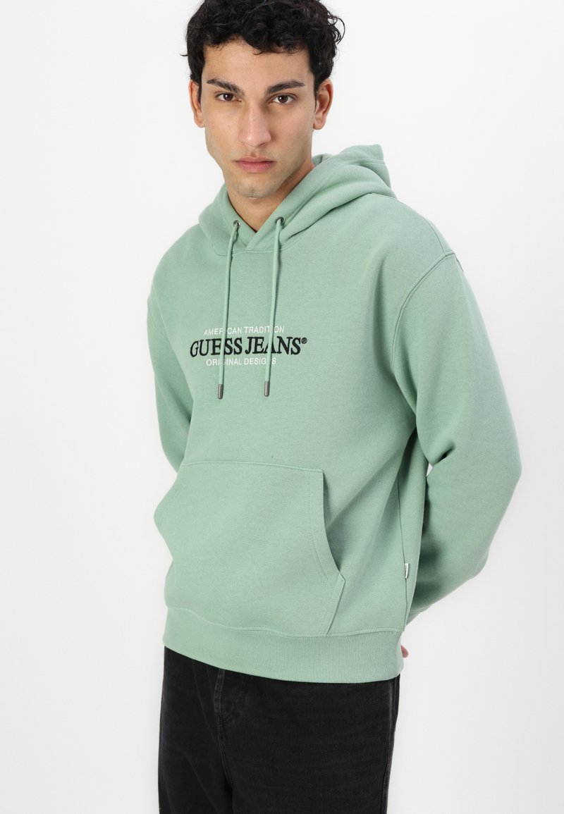 GUESS Jeans Felpa American Tradion Una Felpa Girocollo dalla