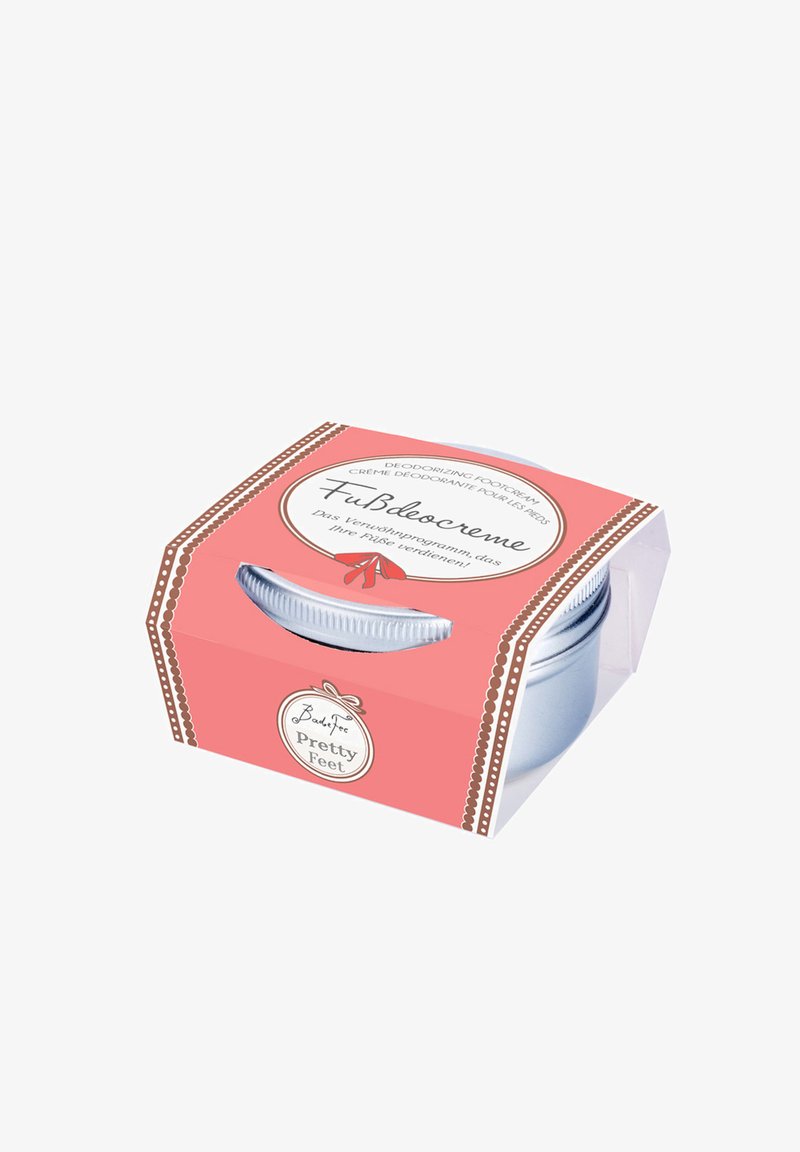 Deodorizing foot cream in a clear plastic container with a silver lid, encased in a pink box featuring white accents and text.