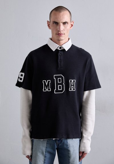 Black short-sleeve polo shirt with white collar, featuring "MBH" text and number "19" on the sleeve; textured material, straight hem.