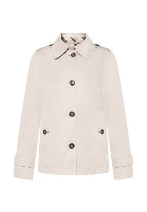 Lichtbeige jas van gestructureerde stof, met een knoopsluiting aan de voorkant, een puntige kraag en twee zijzakken met zwarte knopen.