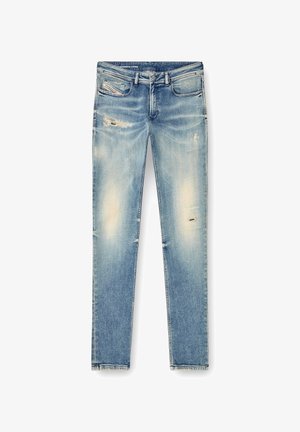 Lys blå denimjeans med rett passform, med falmede områder og slitte detaljer ved knærne og lommene.