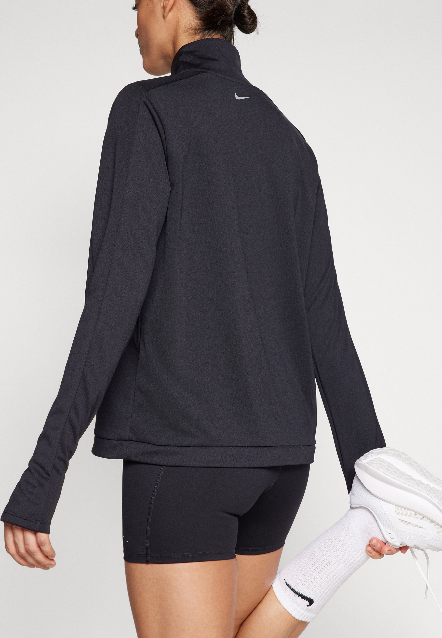 nike swoosh contrast seam long sleeve top in black