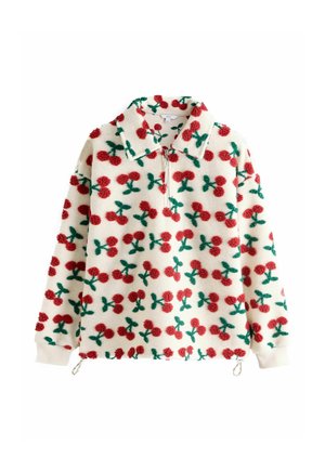 Fliisist pusak, millel on lukk ning punaste pompom-kirsside ja roheliste lehtedega kreemjal taustal. Sisaldab kraed ja elastseid mansette.