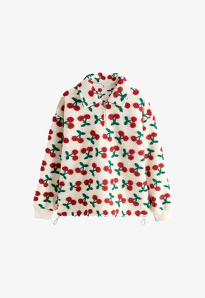 Fliisist pusak, millel on lukk ning punaste pompom-kirsside ja roheliste lehtedega kreemjal taustal. Sisaldab kraed ja elastseid mansette.