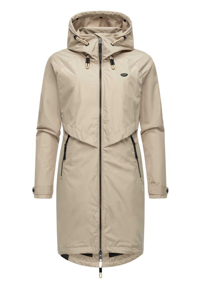 Manteau imperméable beige avec capuche, fermeture éclair avant intégrale, réglages avec cordon, et deux poches latérales avec fermetures éclair. Tissu lisse et léger.
