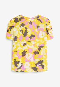 Top jaune à manches courtes avec un motif floral en rose, blanc et marron. Il présente des manches froncées et un col rond.