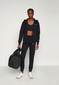 Champion ICONS CUF PANTS - Spodnji deli trenirk - black