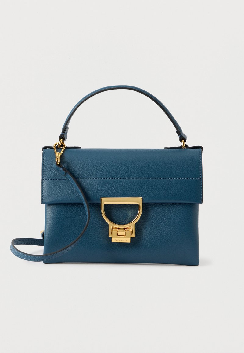 Blue leather handbag with gold hardware, rectangular shape, top handle, and detachable shoulder strap. Textured finish with a clasp closure.