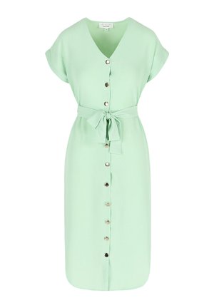 Minti zaļš kleita ar V-veida kakla izgriezumu, īsām piedurknēm, pogu priekšpusi un sasietu jostas siksnu. Gluda auduma ar metāliskiem pogu akcentiem.