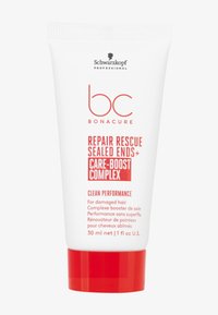 Witte plastic buis met een rode dop, met vetgedrukte rode tekst. Bevat 30 ml haarherstelproduct met het label 'Repair Rescue Sealed Ends'.