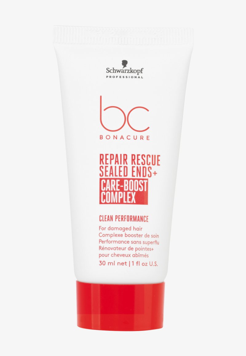 Witte plastic buis met een rode dop, met vetgedrukte rode tekst. Bevat 30 ml haarherstelproduct met het label 'Repair Rescue Sealed Ends'.