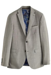 Blazer gris claro con acabado texturizado, dos botones y solapa con muesca. En el interior presenta un forro con patrón de cachemira azul y un bolsillo en el pecho.