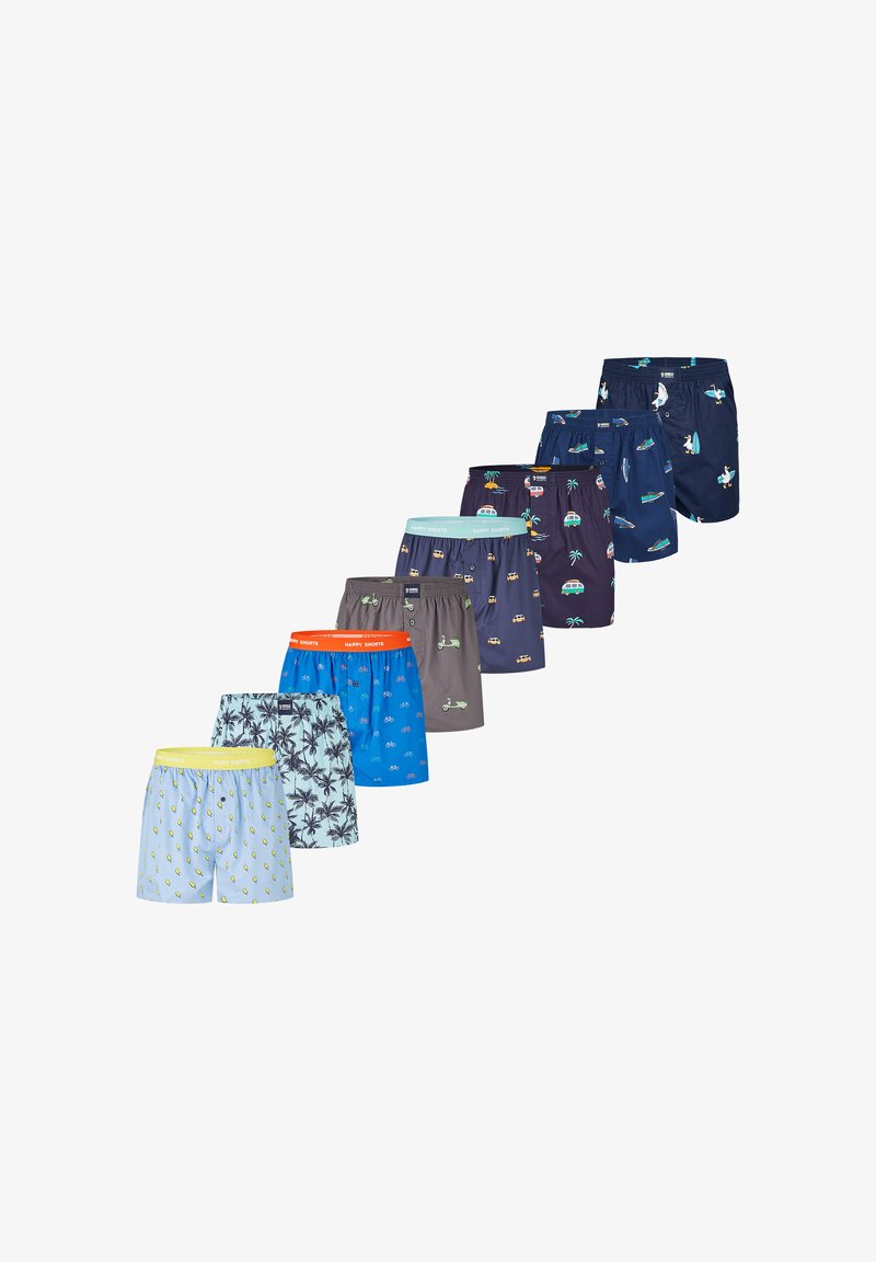 Sept paires de boxers pour hommes colorés avec divers motifs, notamment citrons, palmiers, vélos, scooters, voitures et planches de surf, disposés en diagonale.