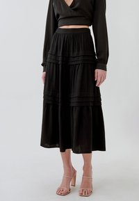 TUSSAH LAIDEY - Falda acampanada - black