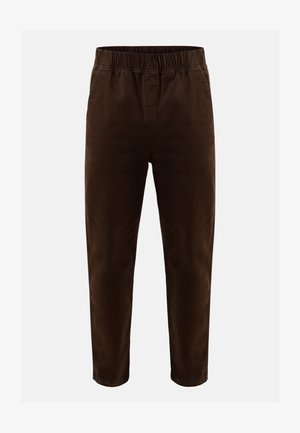 Pantalones de algodón marrón con una cinturilla elástica, diseño de pierna ajustada y sin bolsillos ni adornos visibles. Textura suave.