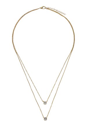 Delikatny naszyjnik z podwójnym złotym łańcuszkiem, z dwoma małymi, okrągłymi wisiorkami z przezroczystych kamieni szlachetnych na różnych długościach.