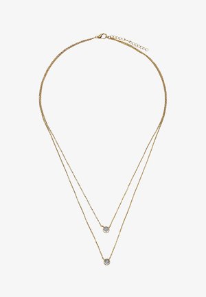 Delikatny naszyjnik z podwójnym złotym łańcuszkiem, z dwoma małymi, okrągłymi wisiorkami z przezroczystych kamieni szlachetnych na różnych długościach.