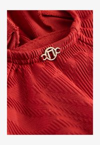 Unselected, rust red textured