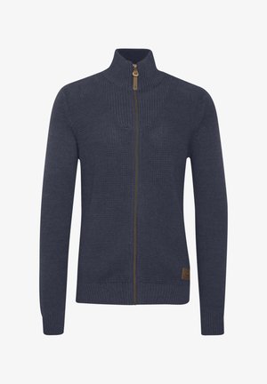 Maglione zip-up blu navy con un design a maglia testurizzata, colletto e polsini a coste, dotato di una cerniera e un logo a contrasto.
