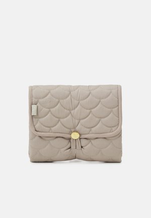 Quilted beige folding pouch with a scalloped pattern, featuring a central knot detail and a yellow button closure.