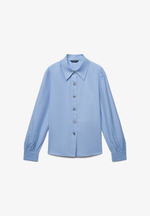 Light blue long-sleeve blouse with a large collar, button front, and puffed sleeves. Made from smooth fabric with silver-tone buttons.