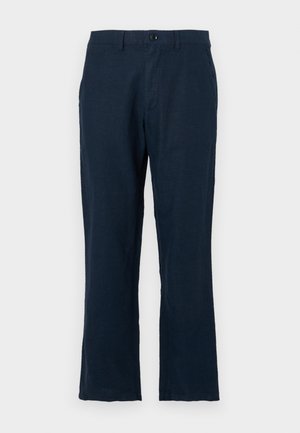 Pantalons en lin bleu marine au cut droit, avec fermeture à bouton et poches standard. Le tissu a une texture lisse et un minimum de détails.