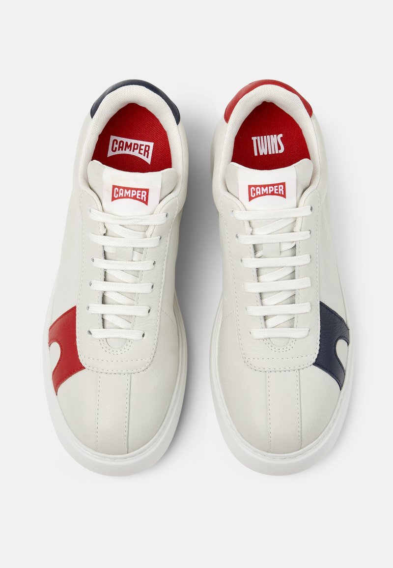 Pair of white Camper sneakers with red and navy accents, white laces, and red insoles labeled "Camper" and "Twins" viewed from above.