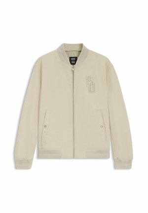 Bomber jacket beige chiaro con zip, colletto, polsini e orlo a coste, due tasche frontali con bottoni a pressione e ricamo "SD" sul petto sinistro.