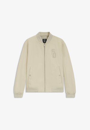 Bomber jacket beige chiaro con zip, colletto, polsini e orlo a coste, due tasche frontali con bottoni a pressione e ricamo "SD" sul petto sinistro.