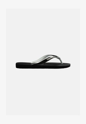 Zwarte rubberen flip-flop met gestructureerde zool en zwart-witte bandjes met de merknaam "havaianas" op een effen achtergrond.