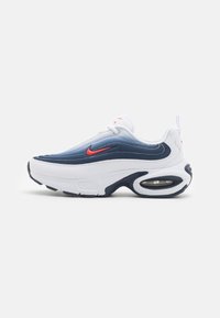 White and navy sneaker with a smooth texture, featuring a wave design, red accents, and visible air cushioning in the sole.
