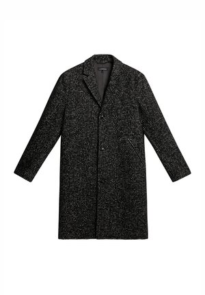 Manteau noir et blanc à pois avec un col en V, deux poches latérales et une fermeture à boutons. Présente des manches longues et une silhouette élancée.