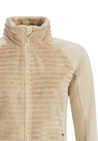 Beige ritsjack met een hoge kraag, met een zachte vachtachtige textuur en een geribbelde uitstraling aan de voorkant, gladde mouwen in bijpassende kleur.