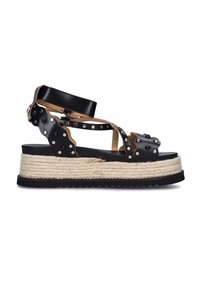 Sandali con zeppa in pelle nera, dotati di borchie argentate, piattaforma in juta intrecciata e suola in gomma nera testurizzata. Presentano una cinturino alla caviglia regolabile.