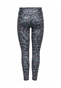 Blommiga leggings med en mörk bakgrund som har små rosa och vita blommor. De har en hög midja och en åtsittande, elastisk design.